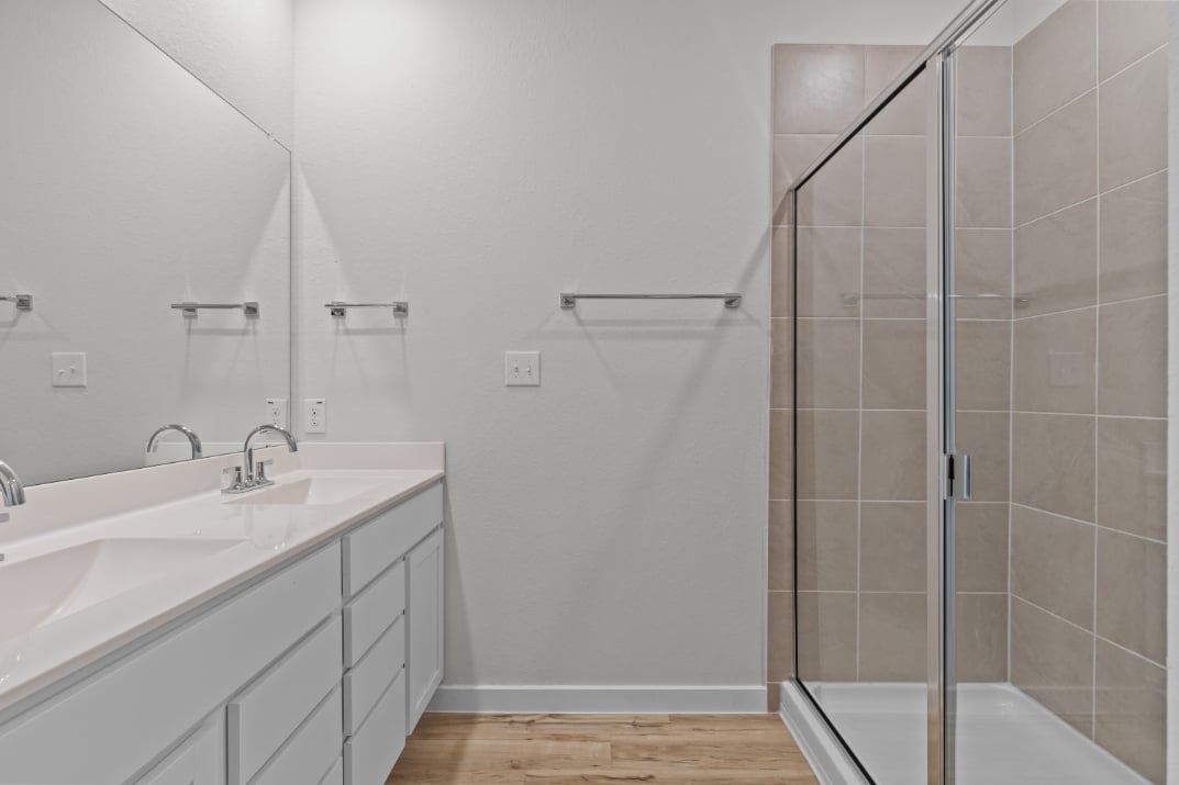 A bathroom with a glass shower.