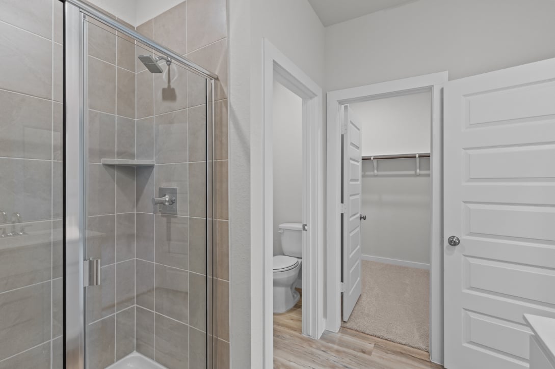 A bathroom with a glass shower.