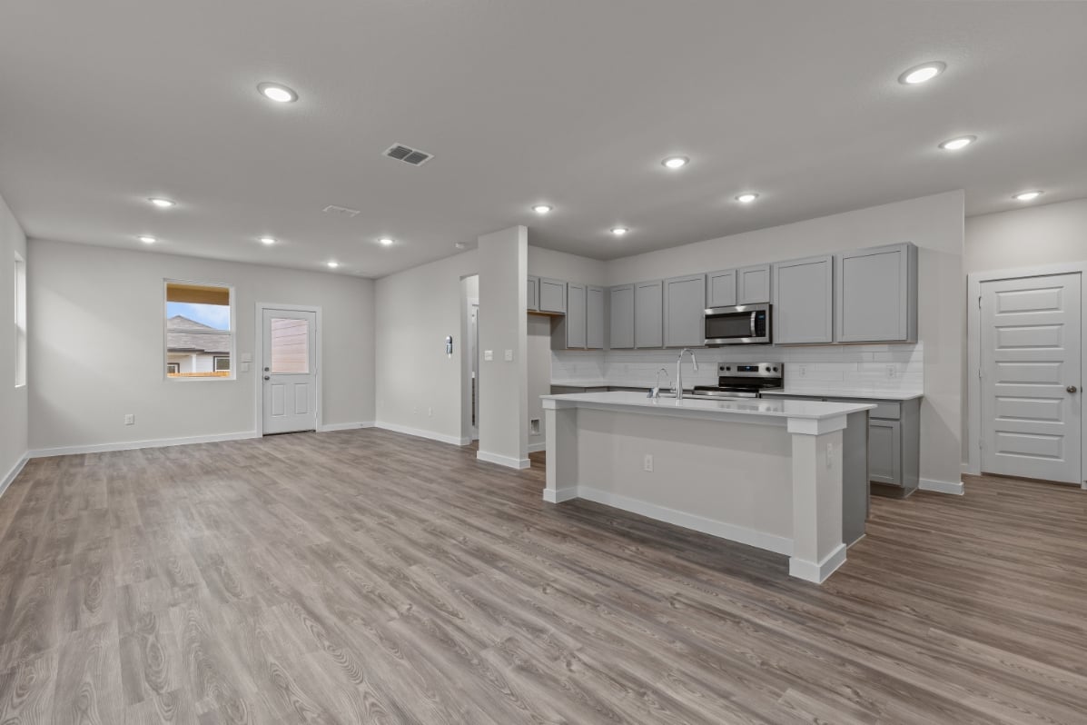 A large kitchen with white cabinets.