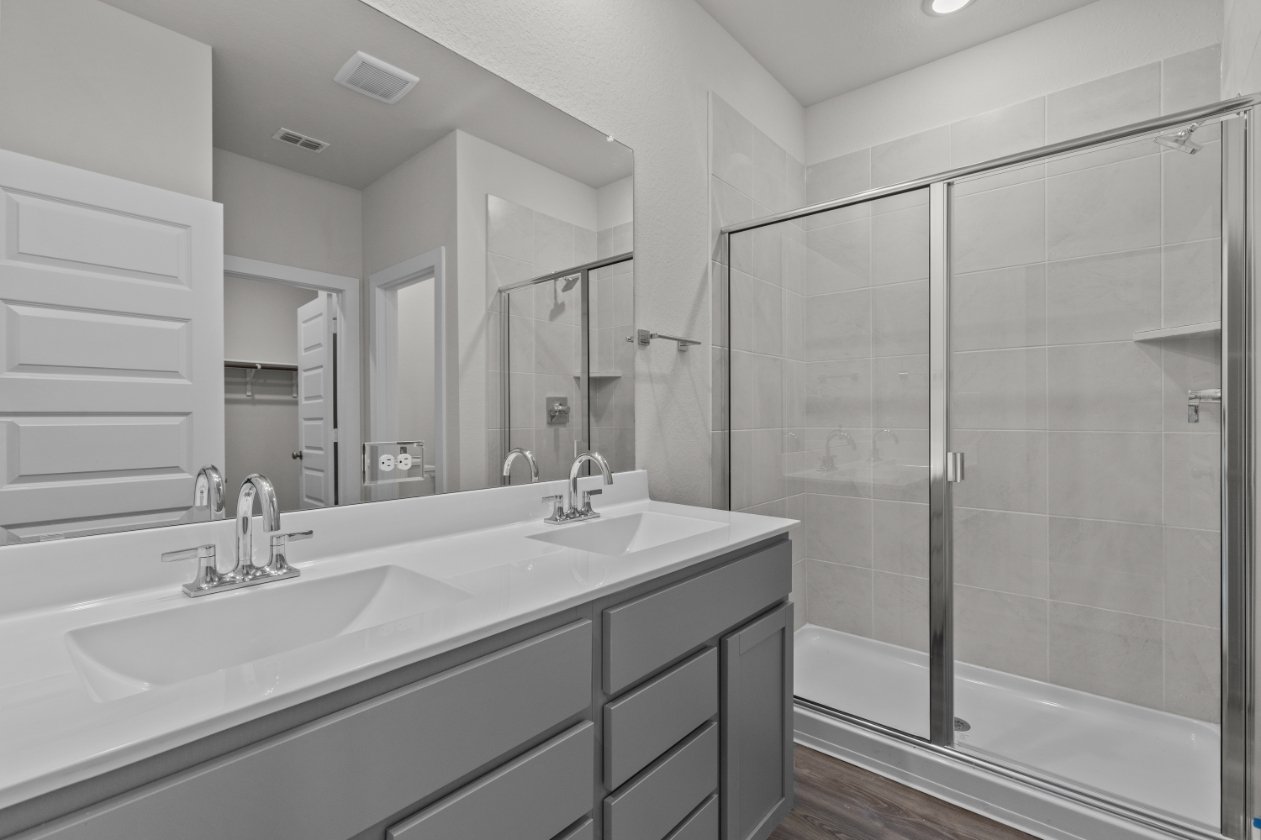 A bathroom with a glass shower.