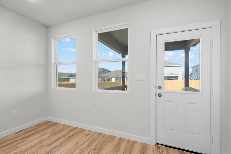 A room with windows and a door.