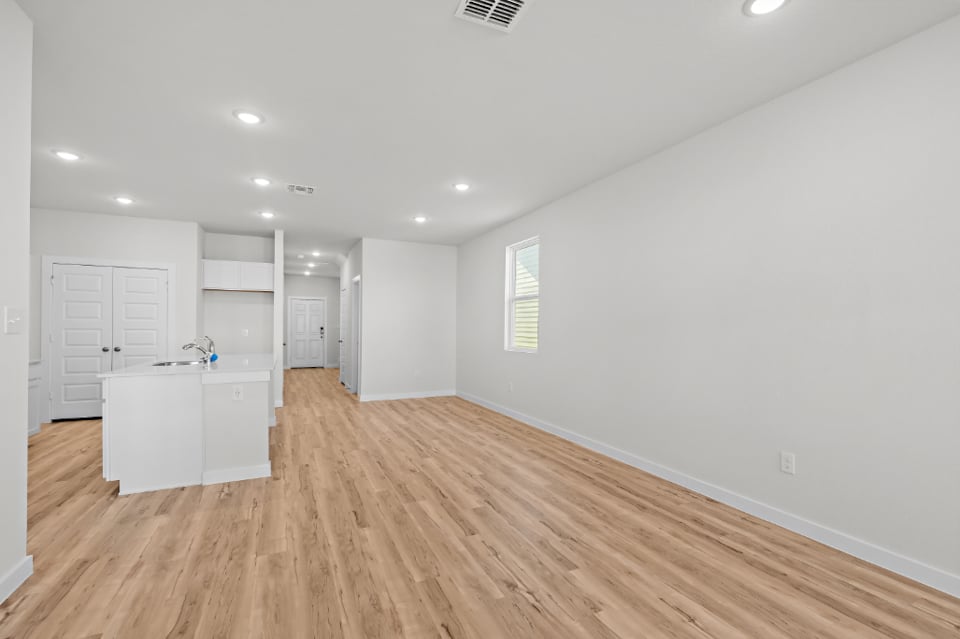 A room with white cabinets.