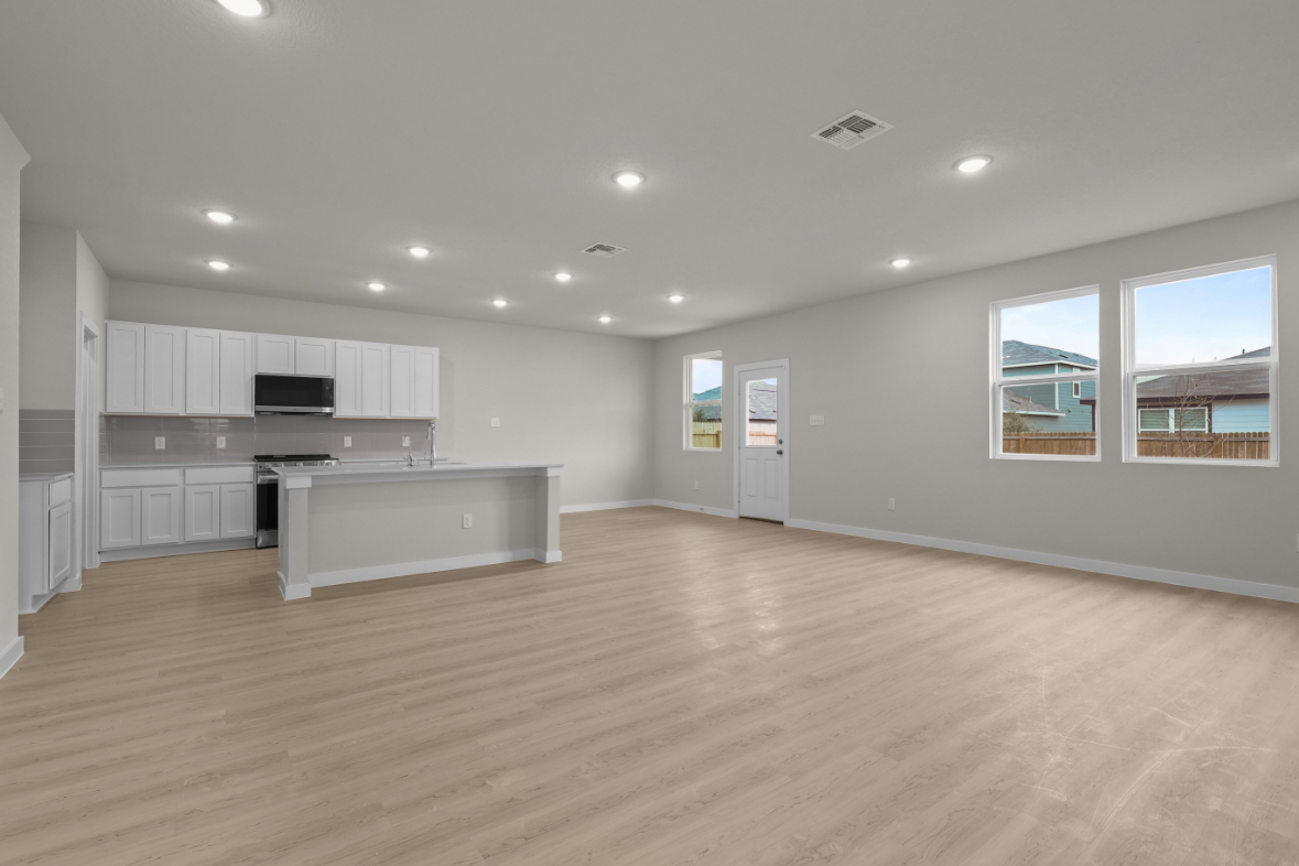 A large kitchen with white cabinets.