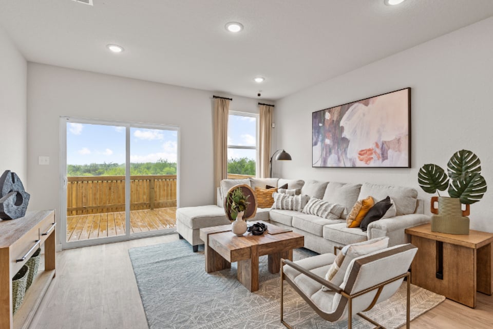 A living room with a large glass door.