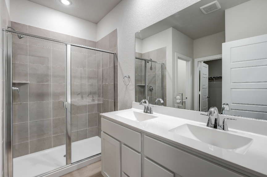 A bathroom with a glass shower.