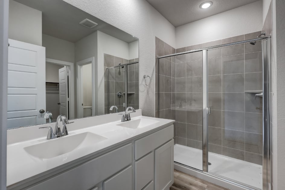 A bathroom with a glass shower.