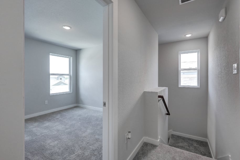 A room with a door and windows.