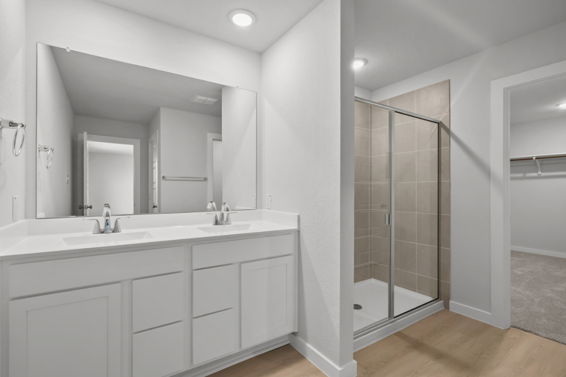 A bathroom with a glass shower.