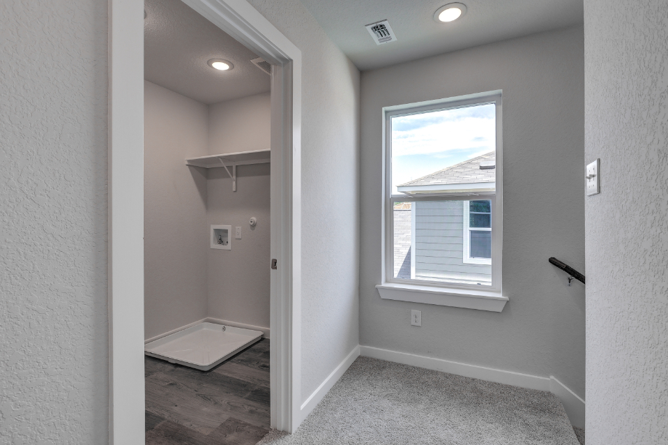 A room with a window and a door.