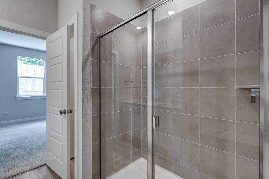 A shower with a glass door.