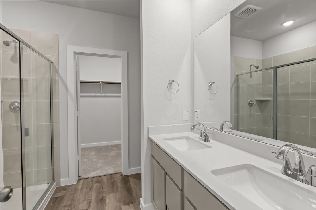 A bathroom with a glass shower.