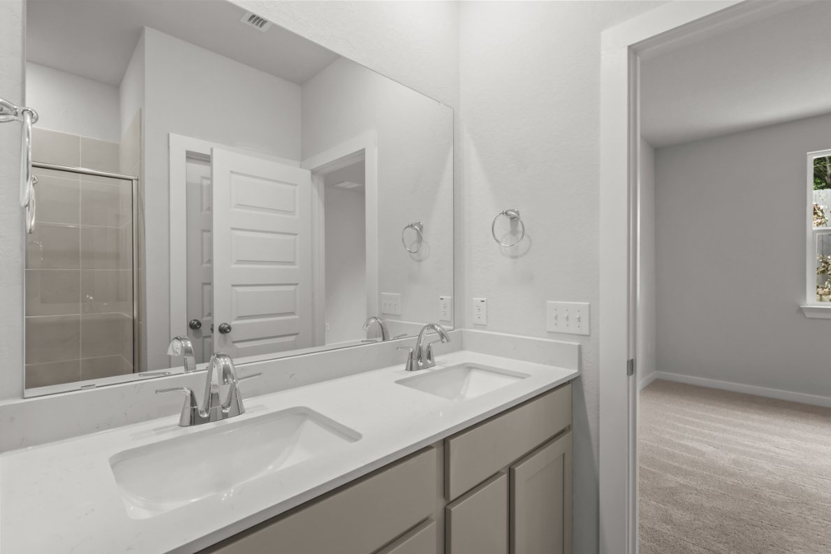 A bathroom with two sinks.