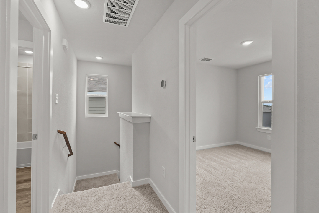 A bathroom with a shower unit.