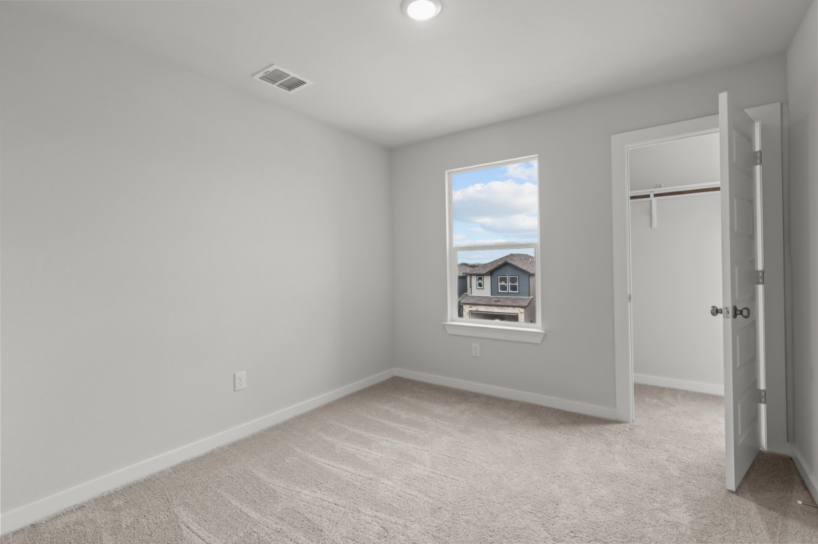 A room with a window and a door.