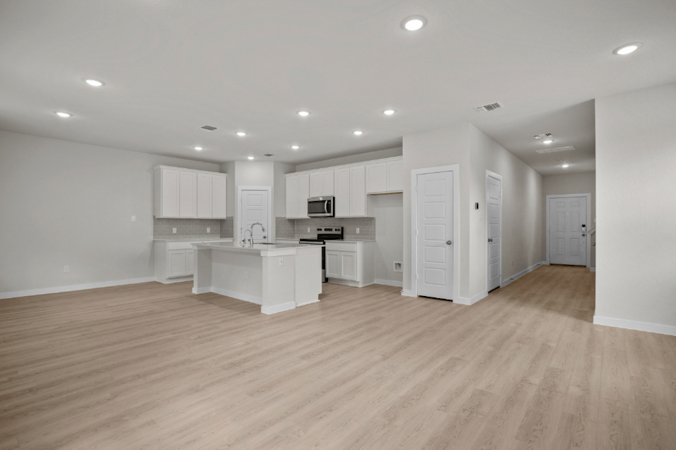 A large kitchen with white cabinets.