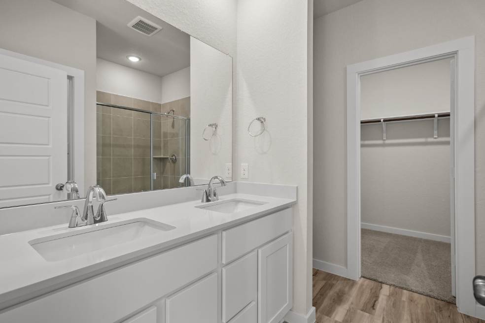 A bathroom with a glass shower.