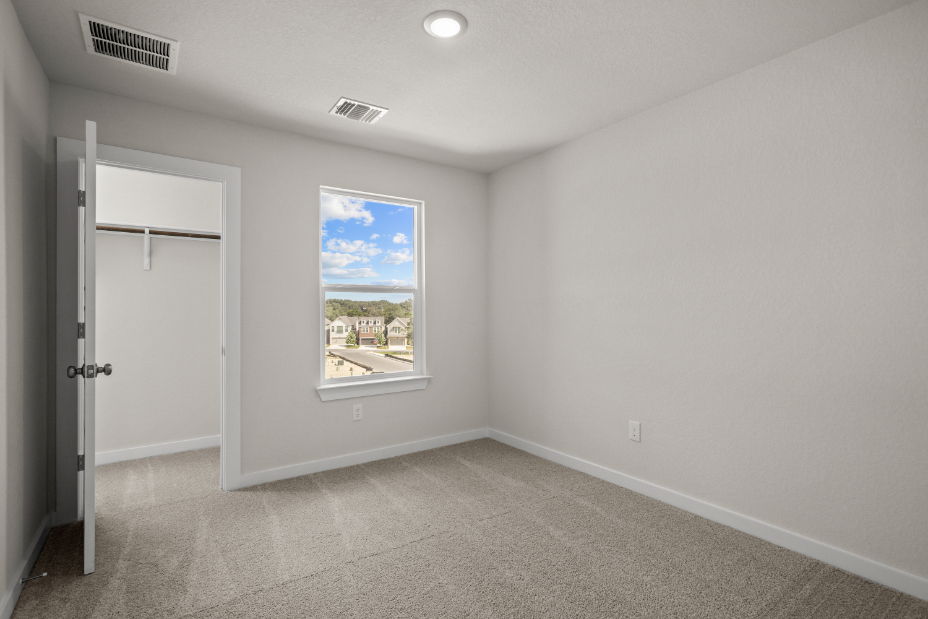 A room with a window and a door.