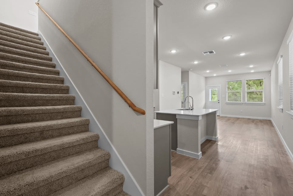 A kitchen and a staircase.