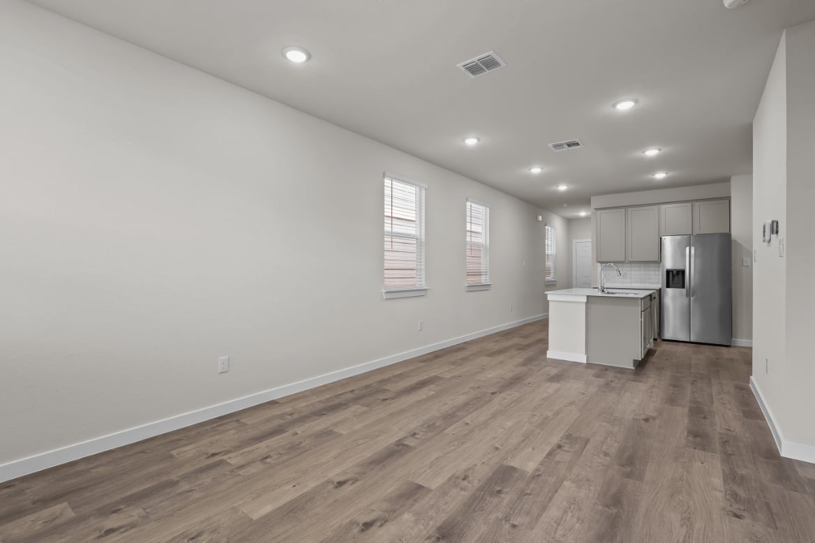 A kitchen with white walls.