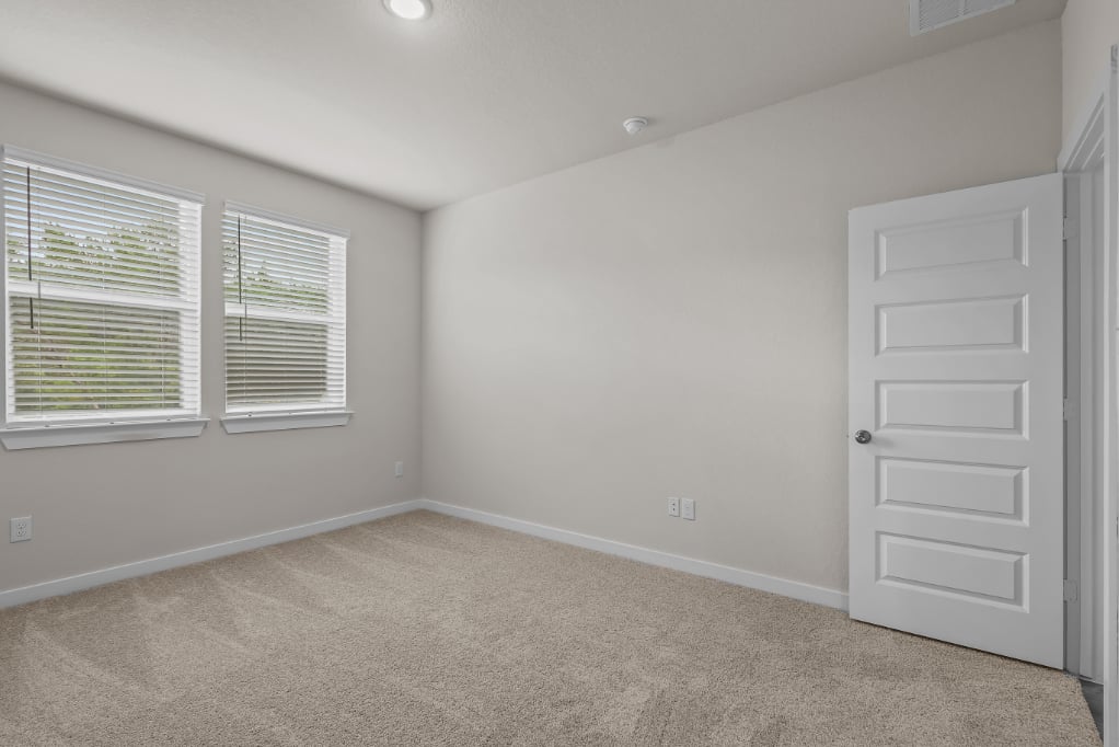 A room with a white door and a white door.