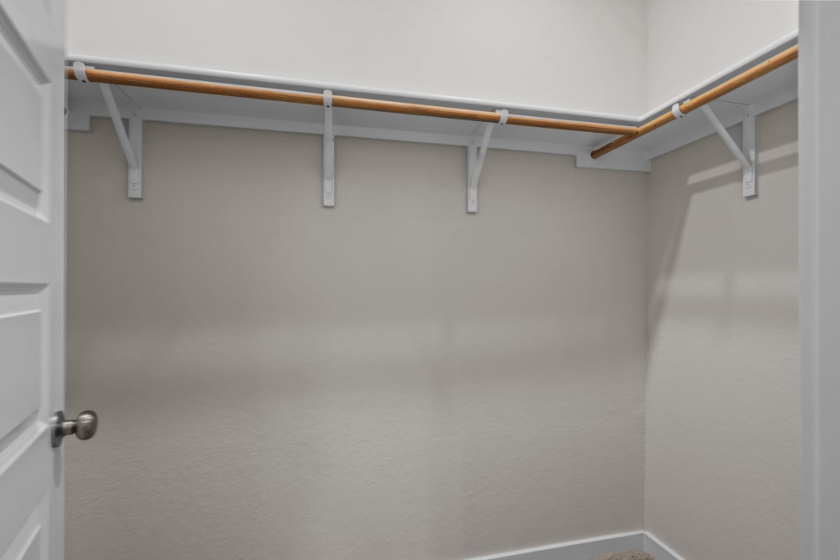 A metal bar on a white wall.