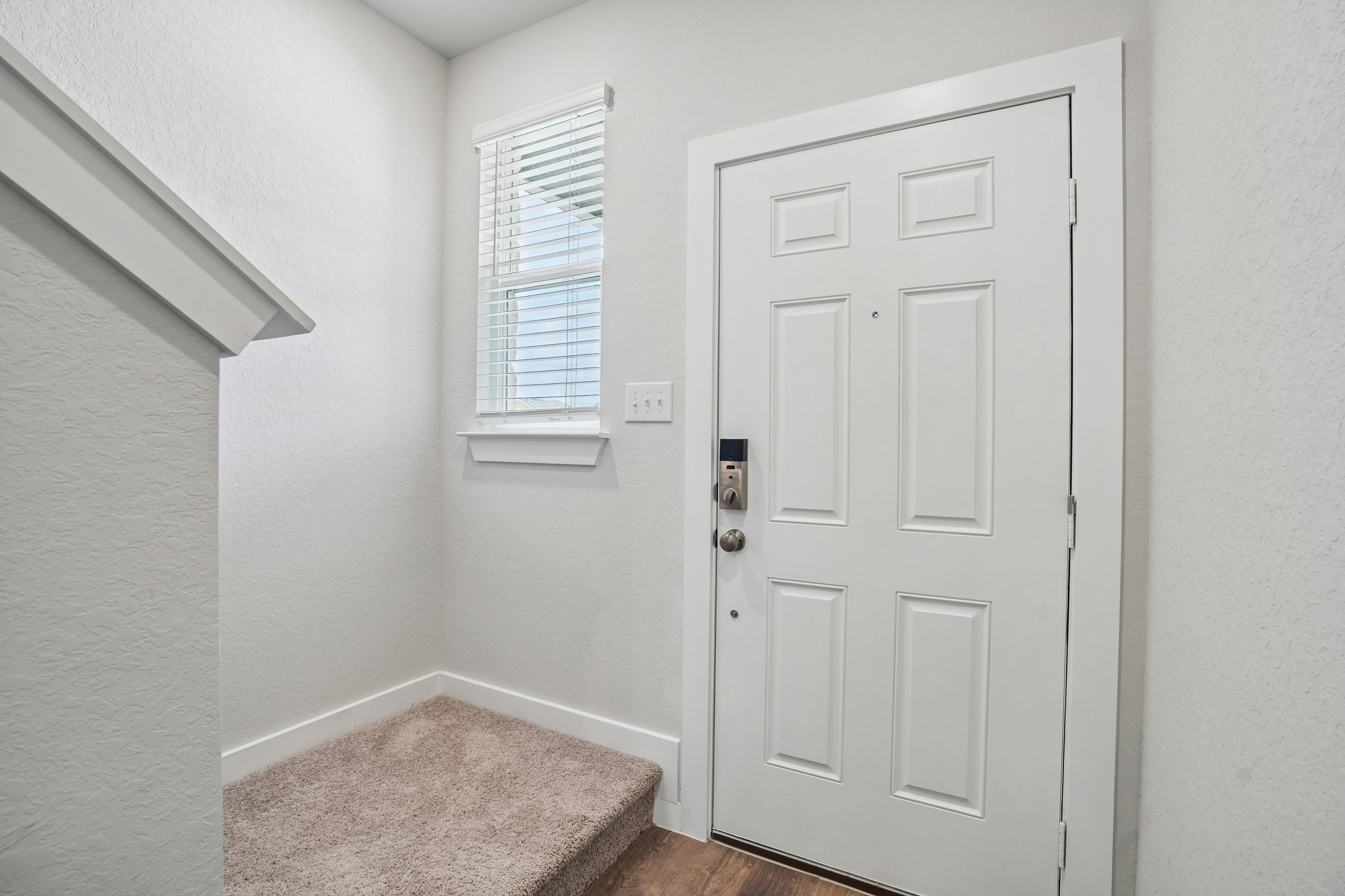 A white door in a room.
