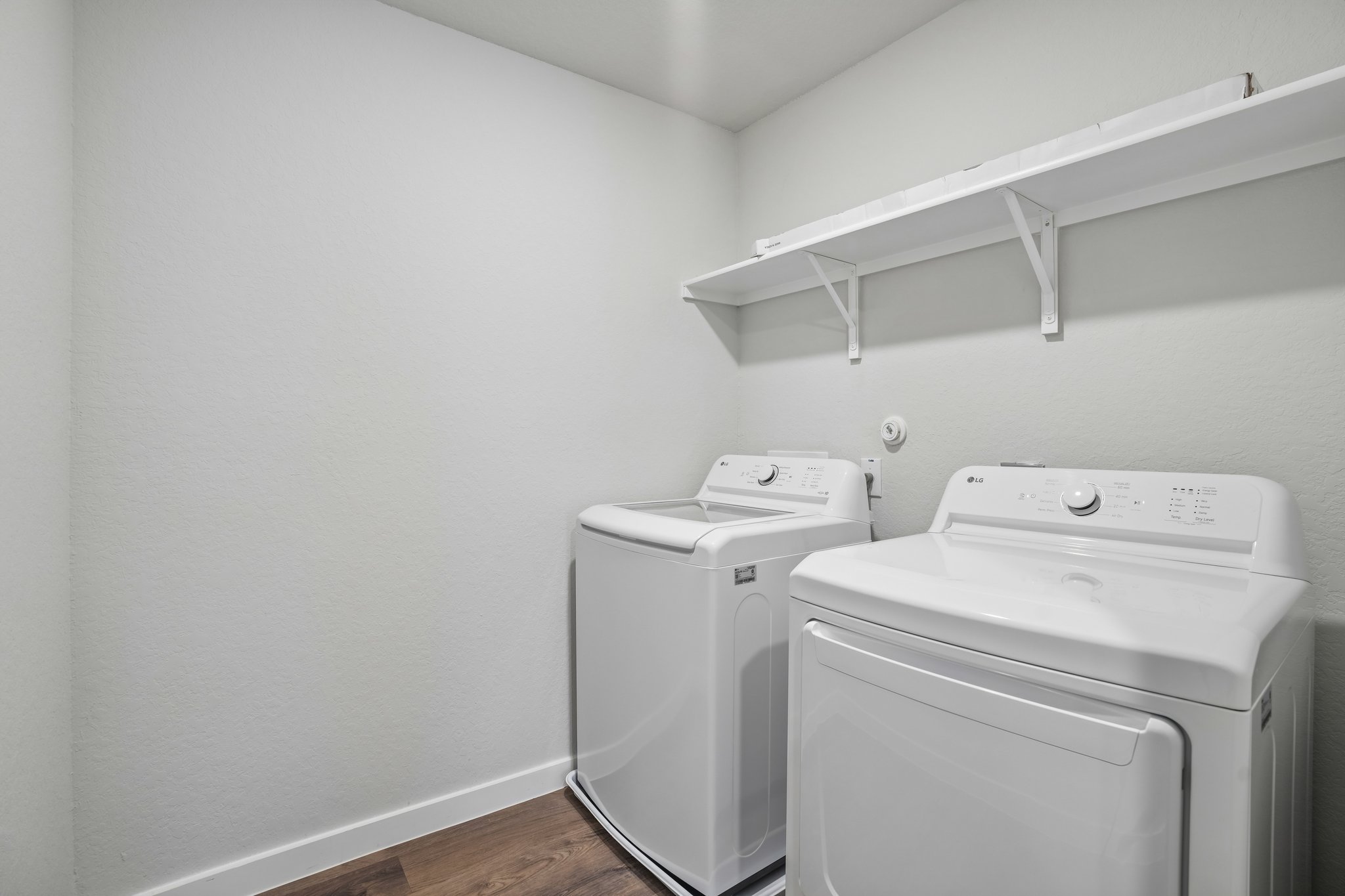 A washing machine in a room.