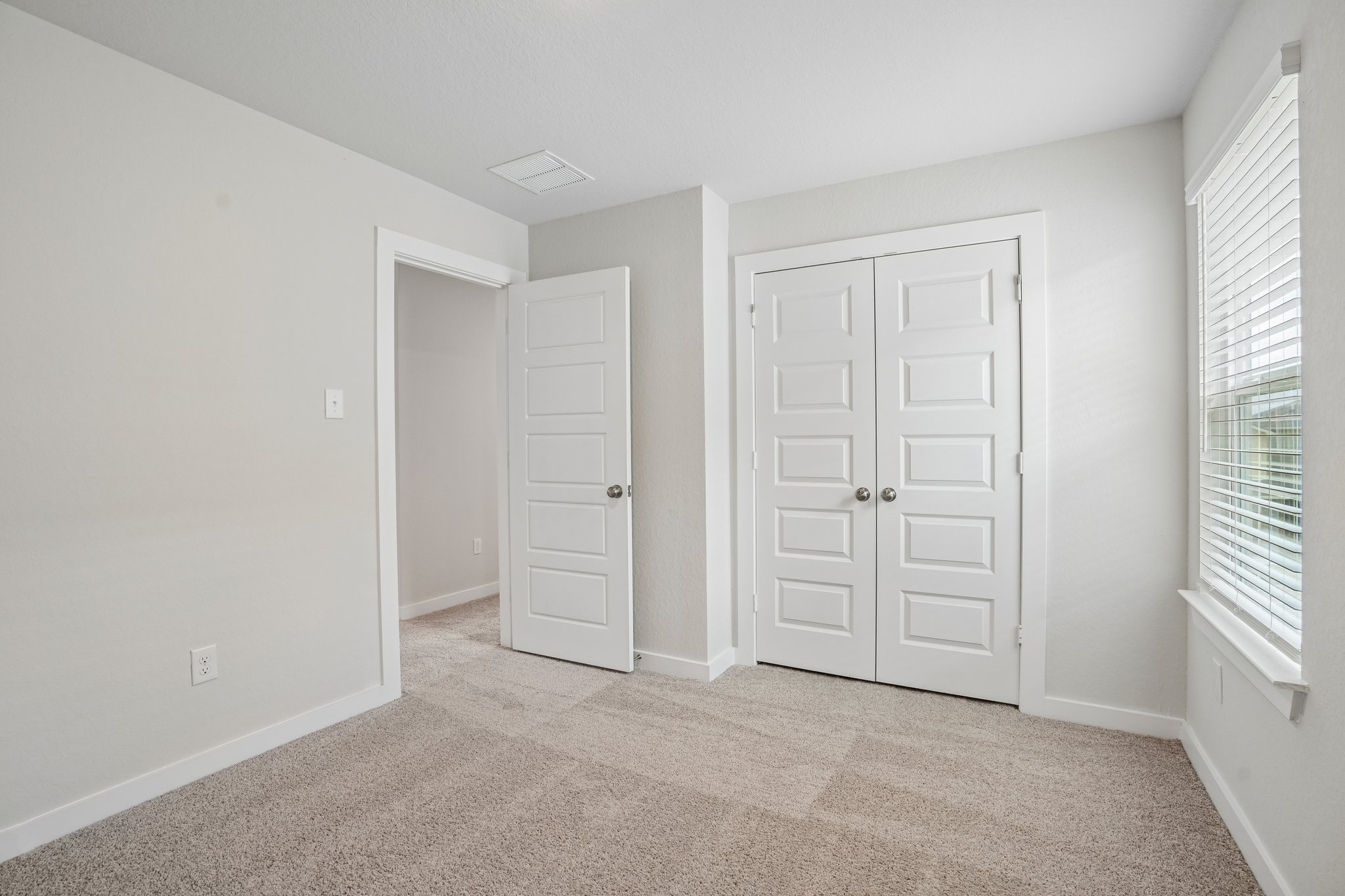 A room with white doors.