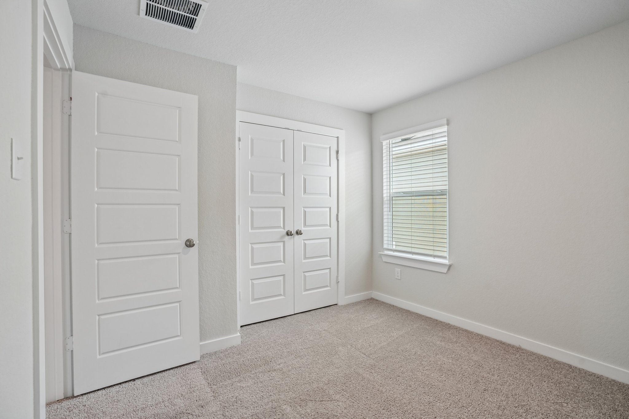 A room with white doors.