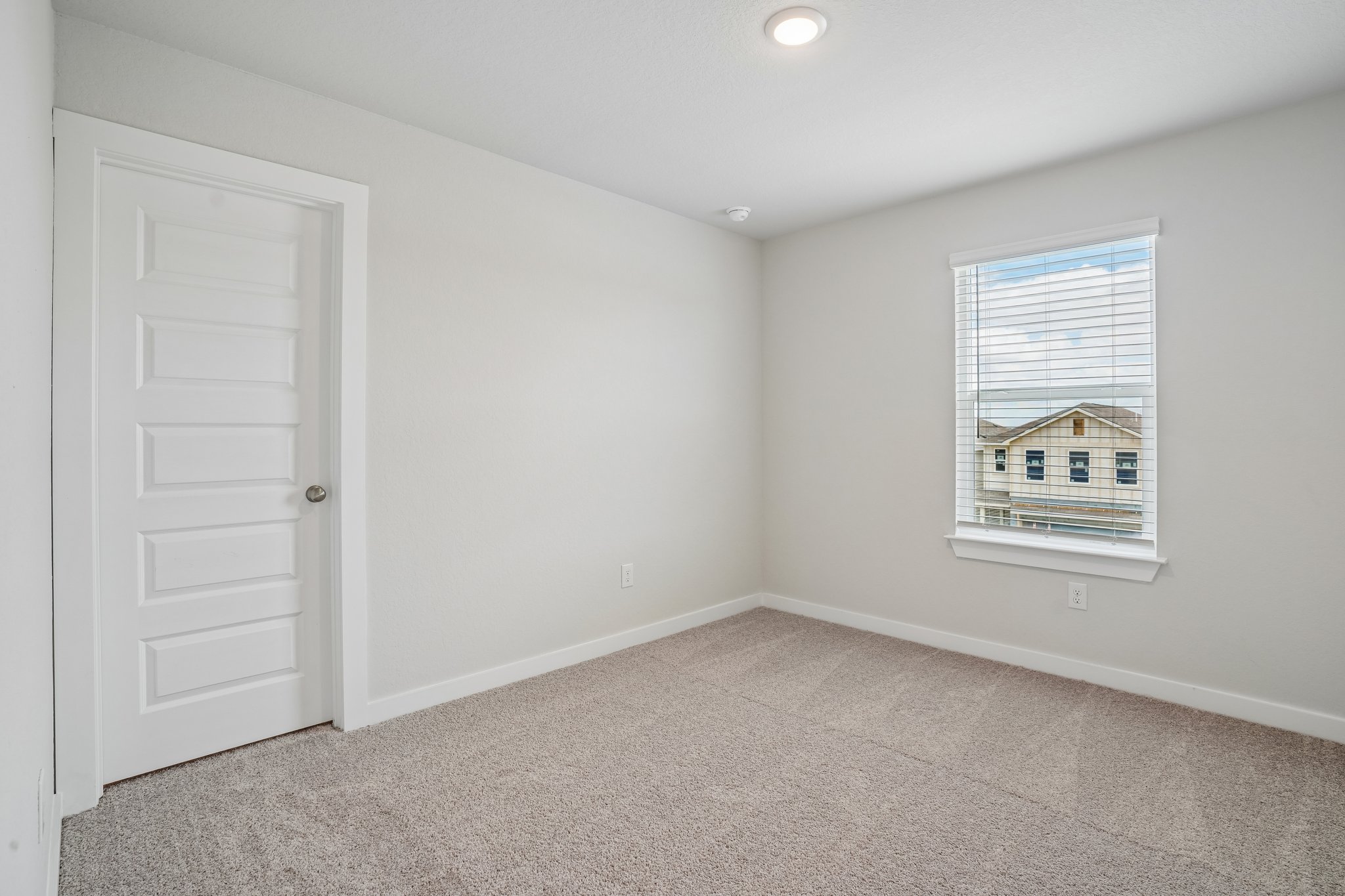 A room with a door and a window.