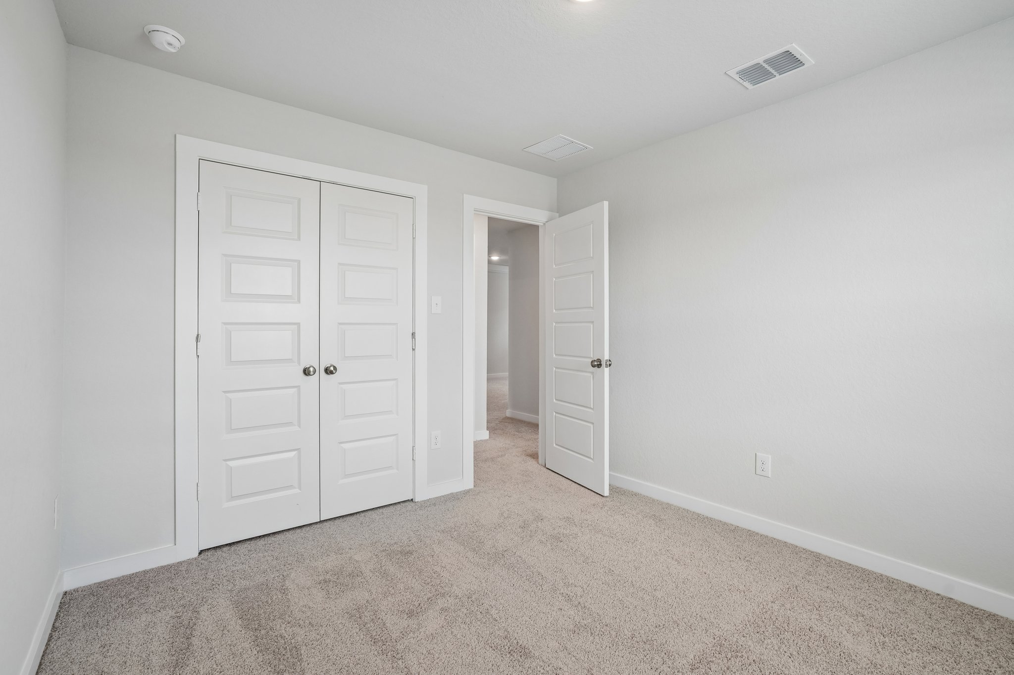 A room with white doors.