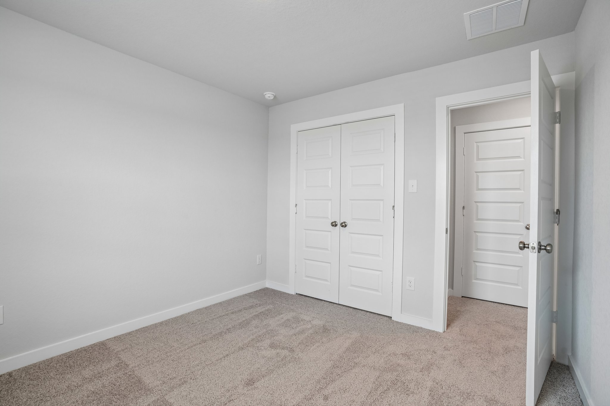 A room with white doors.