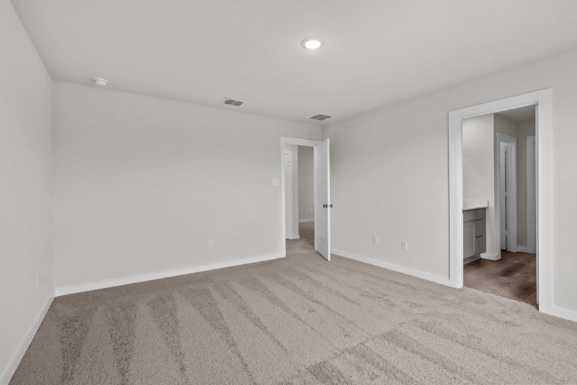 A long hallway with white walls.