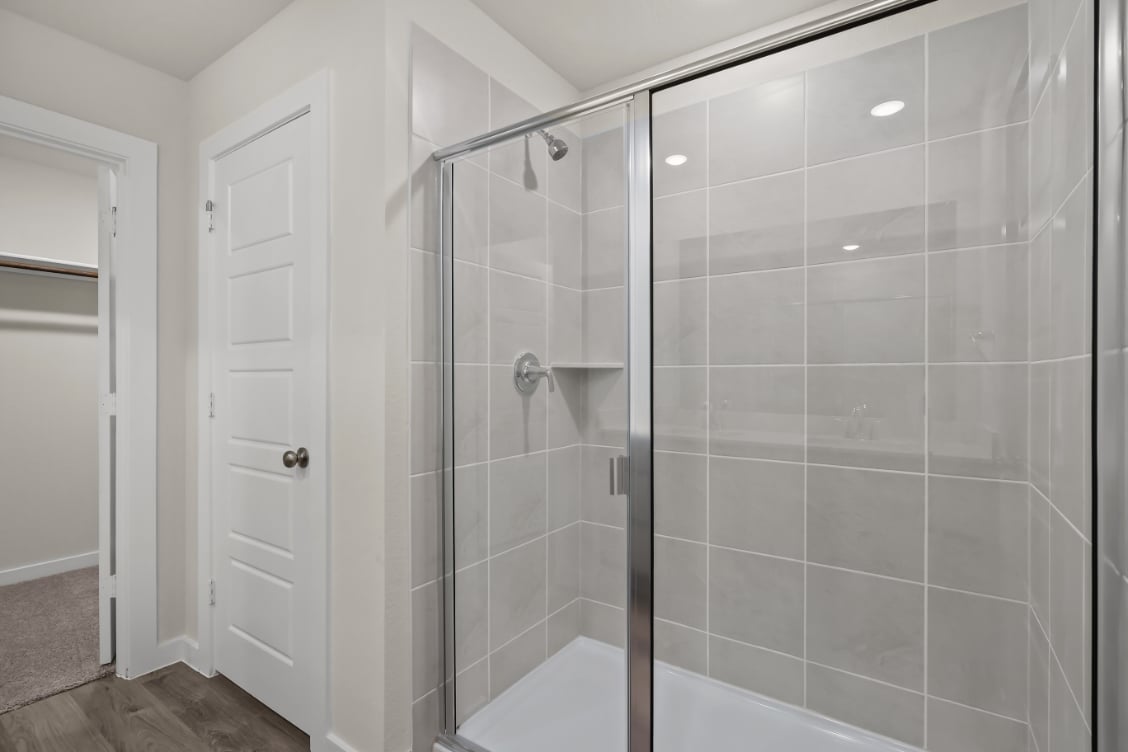 A shower unit in a bathroom.