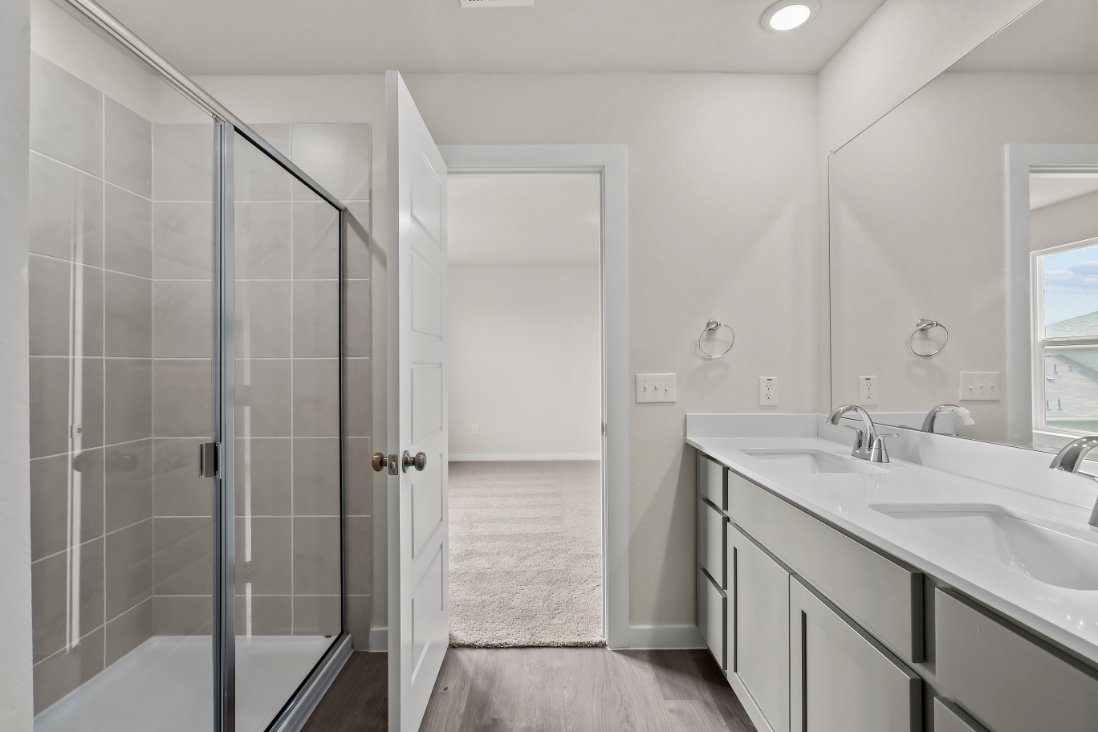 A bathroom with a glass shower.