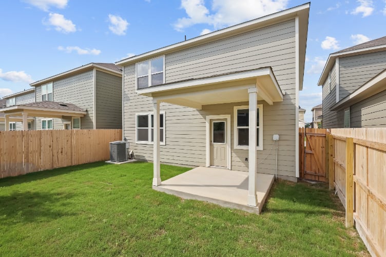 A small house with a fence.