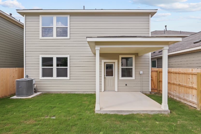A house with a fence and a yard.