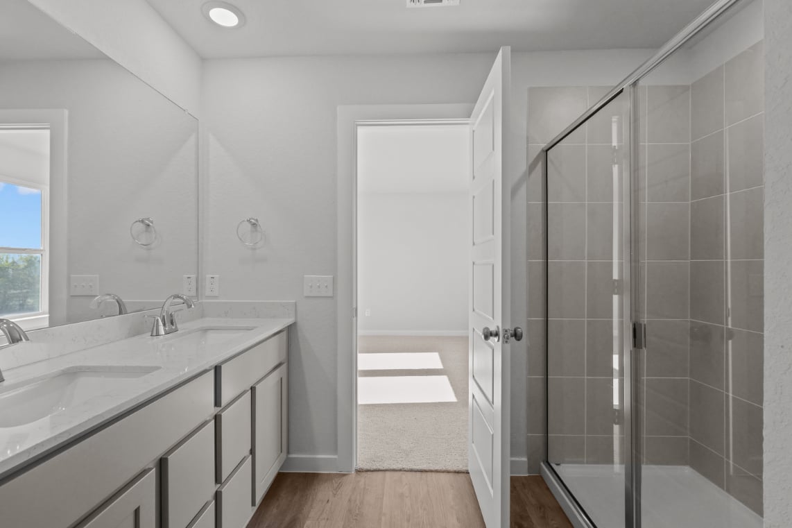A bathroom with a glass shower.