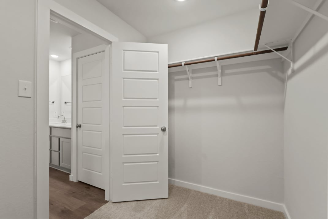 A white closet in a room.