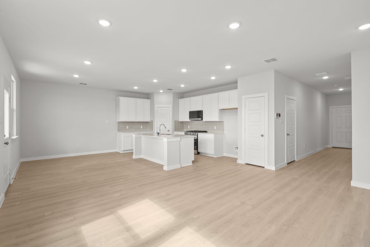 A large kitchen with white cabinets.