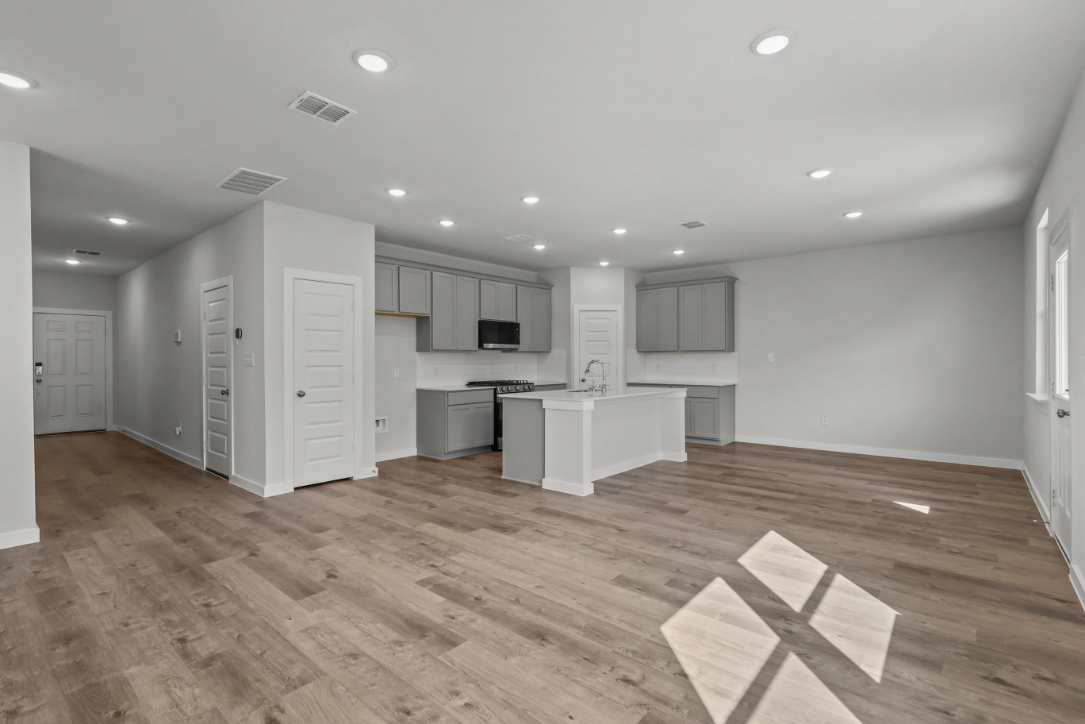 A large kitchen with white cabinets.