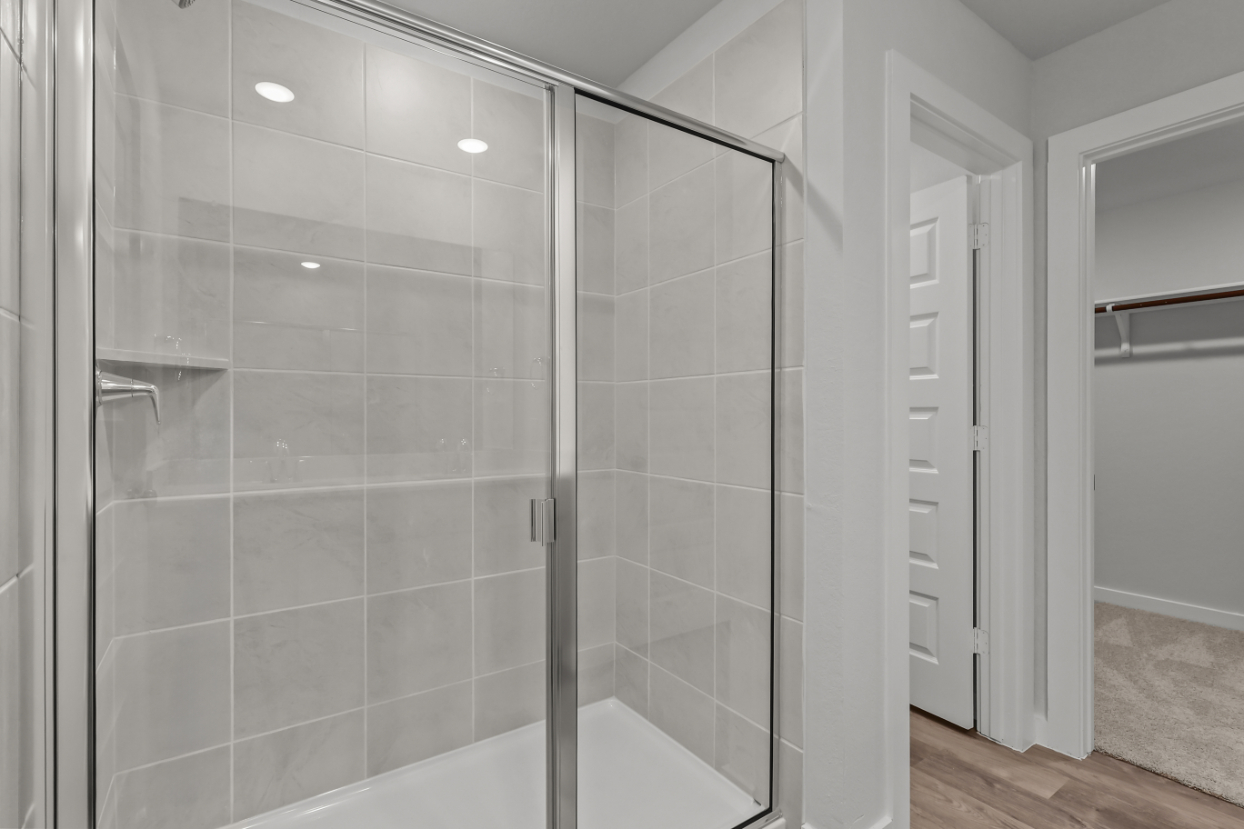A shower with glass doors.