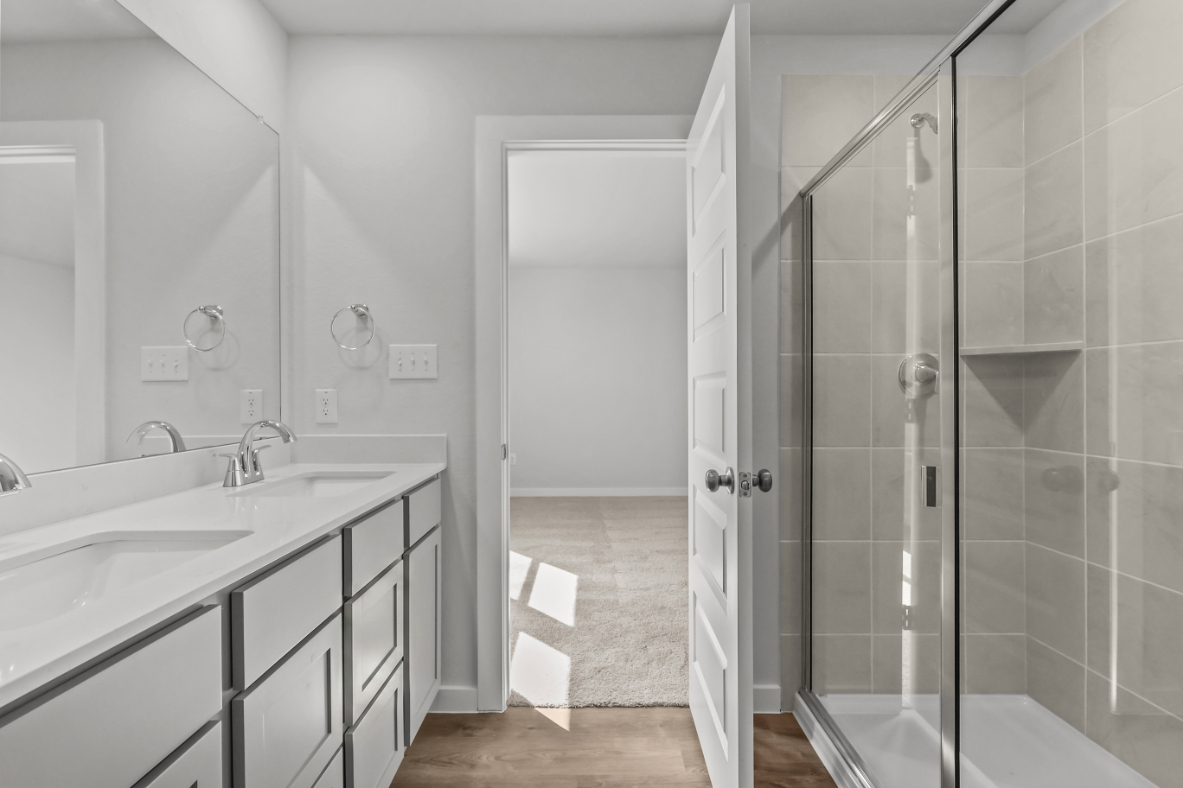 A bathroom with a glass shower.