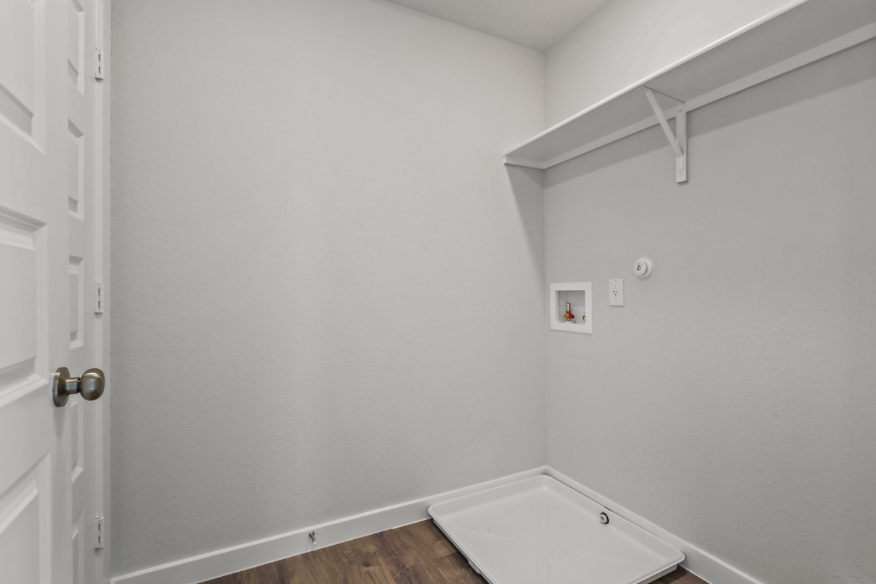 A white bathroom with a sink.