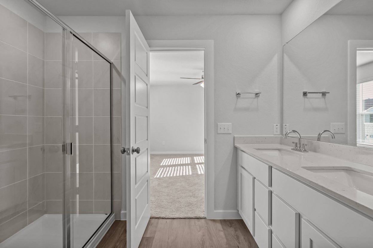 A bathroom with a glass shower.