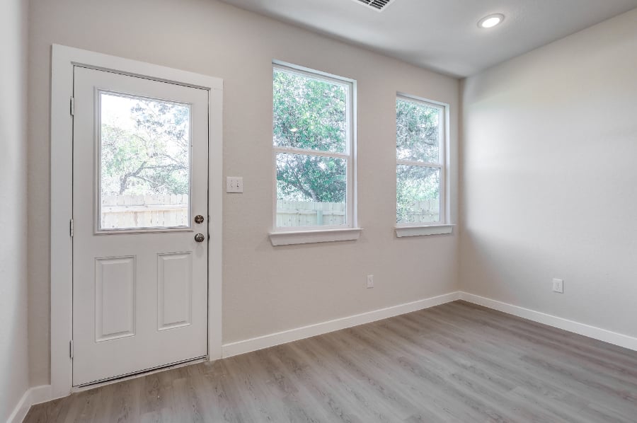 A room with a door and windows.