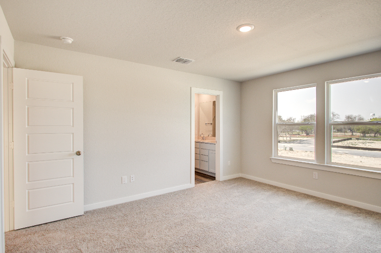 A room with a door and a window.