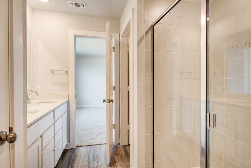 A bathroom with a glass shower.