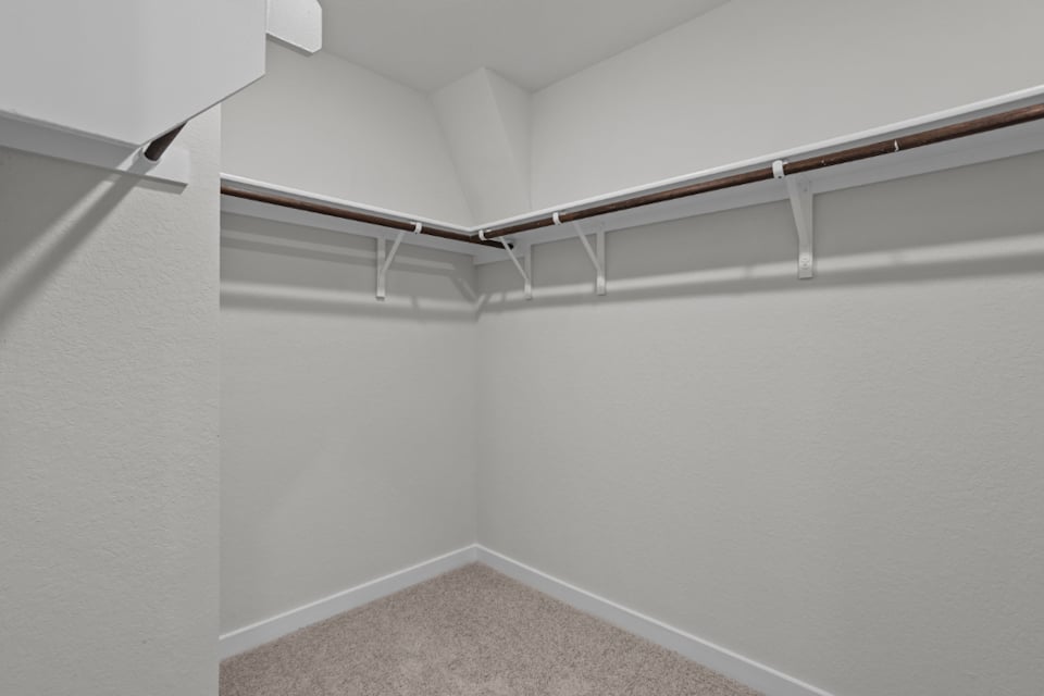 A white staircase in a room.