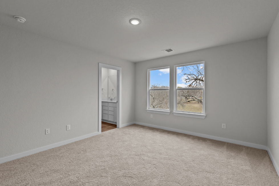 A room with a window and a door.